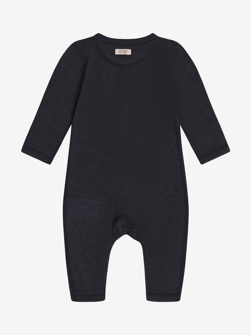 Romper Dark Navy – TENCEL™ & merino wool – Huttelihut: back view of the dark blue romper.